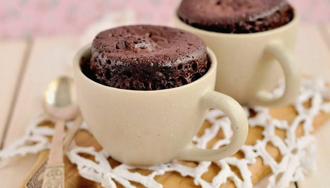 Chocolate muffin in the microwave in a cup