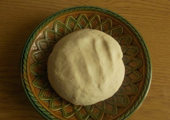 Milk pizza dough in a bread maker